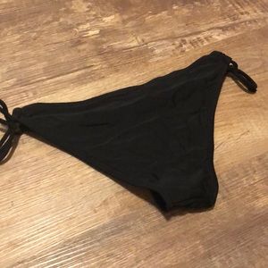 {Black} bathing suit bottom.